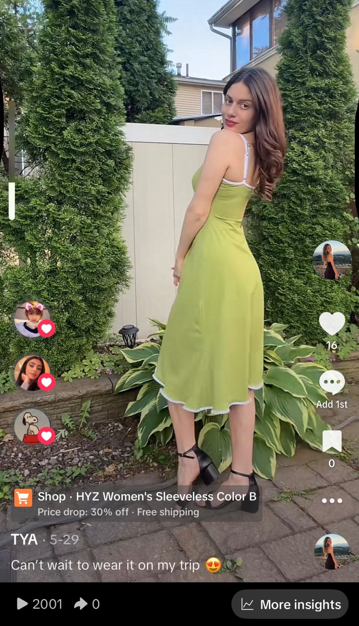 Tya in a lime green slip dress with white trim standing in a garden at golden hour