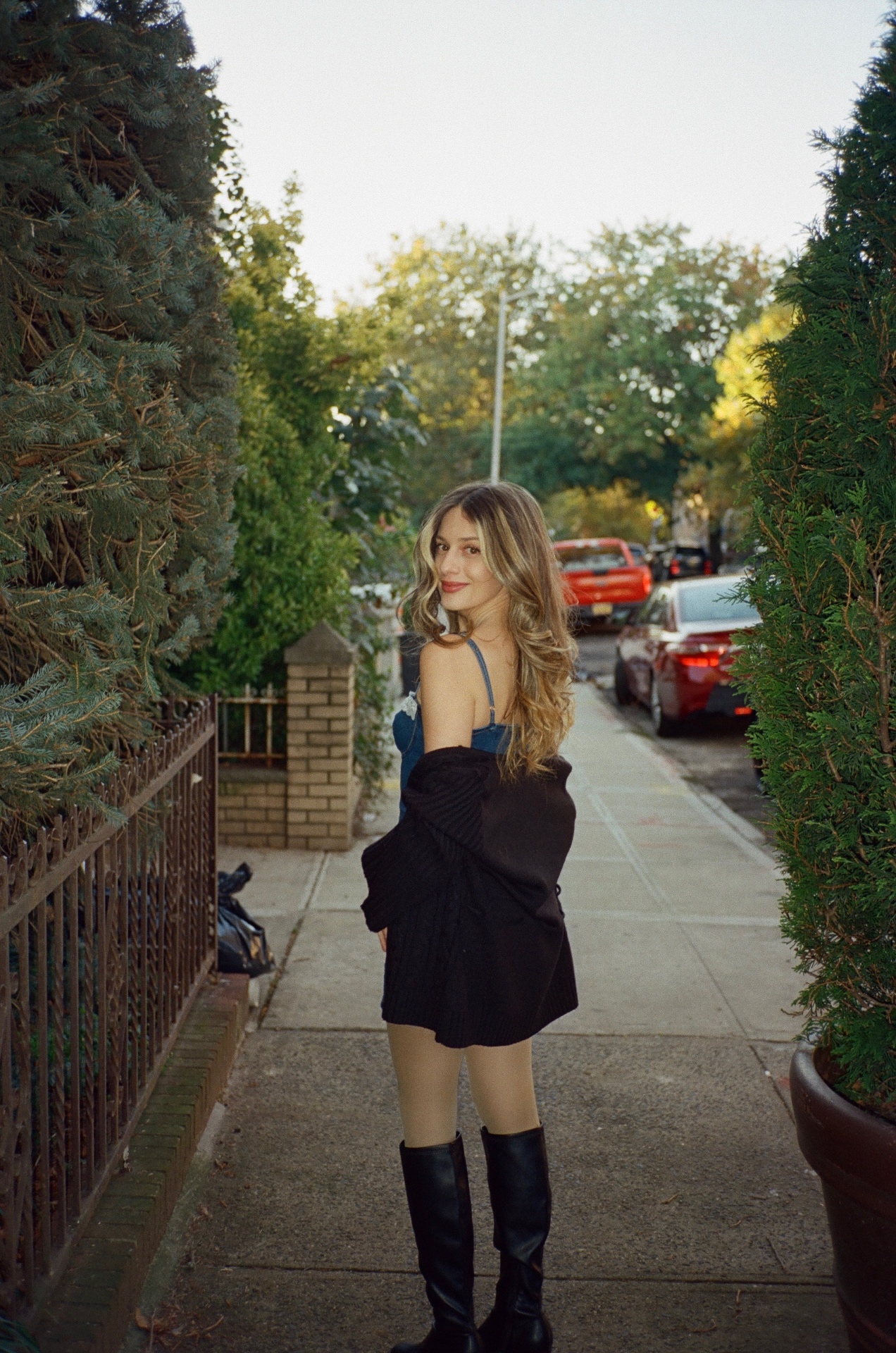 Tya photographed on a tree-lined Brooklyn sidewalk